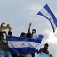 Anti-government demonstrators staging a protest against Nicaraguan President Daniel Ortega and his wife, Vice President Rosario Murillo in May