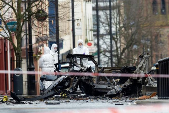 Two men in their twenties were arrested as police and army explosives teams remained at the scene of the blast