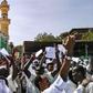 Sudanese protesters chant slogans and raise signs against President Omar al-Bashir during a demonstration in the capital Khartoum's twin city of Omdurman
