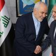 Iraqi Foreign Minister Mohammad Ali al-Hakim (R) receives his Iranian counterpart, Mohammad Javad Zarif, in Baghdad on January 13, 2019