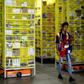 Amazon employee Deasahni Bernard moves among robots at the 855,000-square-foot Amazon fulfillment center in Staten Island February 5, 2019