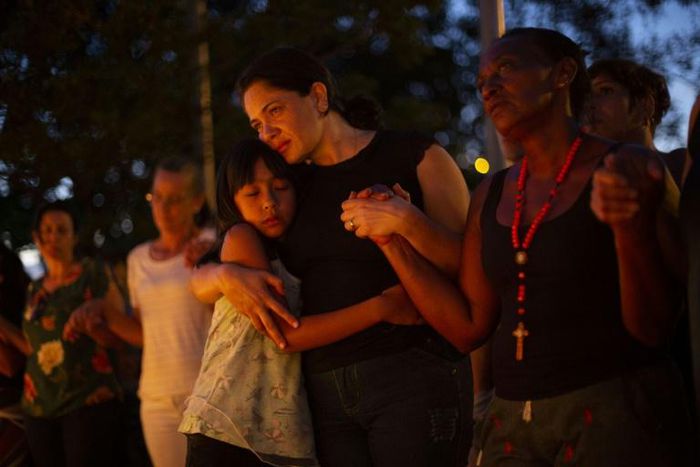 The relatives of victims and the missing hold a vigil in Brumadinho, southeastern Brazil, five days after the collapse of a dam at an iron-ore mine