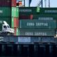 Shipping containers from China and other nations are unloaded at the Long Beach Port in Los Angeles, California; the US and China will resume talks aimed at ending a damaging trade war from Tuesday