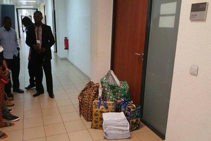 INEC officials standing outside Senator Dino Melaye's office to serve him with recall notice