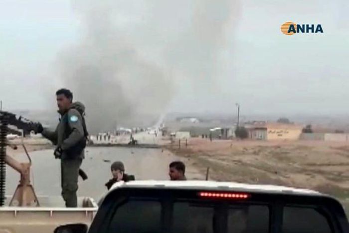 An image grab taken from a video published by Hawar News Agency (ANHA) on January 21, 2019 shows the scene of a suicide car bomb attack on an anti-jihadist coalition convoy in Syria's northeastern Hasakeh province