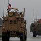 US military vehicles on patrol in Syria's northern city of Manbij on December 30, 2018
