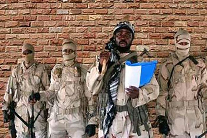 This January 2018 picture taken from a video released by the Islamist militant group Boko Haram shows factional leader Abubakar Shekau (C)