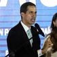 Venezuela's opposition leader Juan Guaido (L) accuses -- with his wife Fabiana Rosales by his side -- the country's security forces of trying to intimidate her