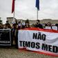 Striking Portuguese nurses hold a banner that reads "We are not afraid" as they demonstrate outside the Santa Maria central hospital in Lisbon