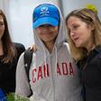 Saudi teenager Rahaf Mohammed al-Qunun (C) is welcomed by Canadian Minister for Foreign Affairs Chrystia Freeland (R) as she arrives at Pearson International airport in Toronto, Ontario, on January 12, 2019