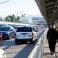 People walk and drive across the international bridge on the US/Mexico border in Laredo, Texas, on January 13, 2019