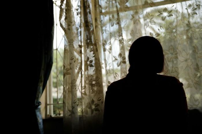 The 33-year-old woman says she was raped by two men