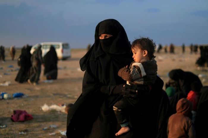 US-backed fighters on Friday trucked some 2,000 people out of the Islamic State group's last scrap of territory in eastern Syria