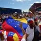 Flag-waving Venezuelan opposition supporters rallied on February 23, 2019 in the port of Willemstad, Curacao, where red trucks carried aid intended for Venezuela