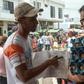 Giovanni Jose Plaza (L), a Venezuelan migrant suffering from AIDS, asks passersby in the border town of Cucuta, Colombia for money to buy medications