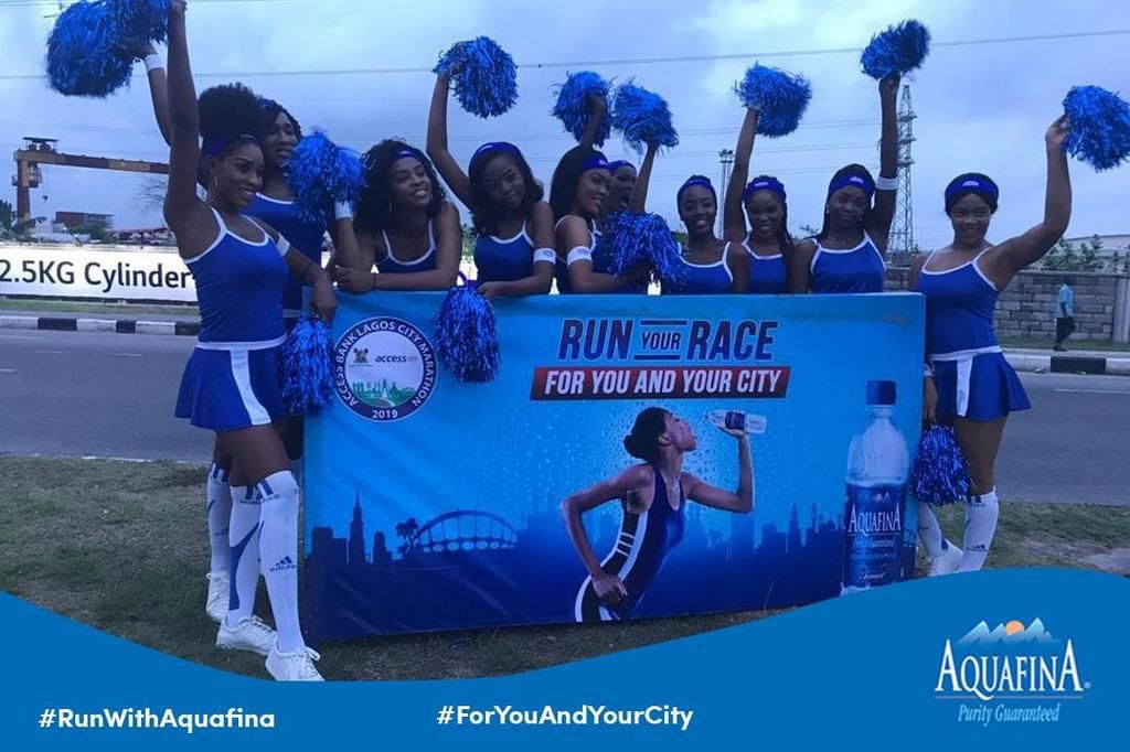 Aquafina cheer team cheering on the runners