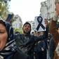 Young demonstrators take part in a protest against President Abdelaziz Bouteflika's candidacy for a fifth term in Algiers