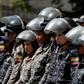 Members of the Bolivarian National Police stand guard in Caracas, during a protest against the government of President Nicolas Maduro on January 30, 2019