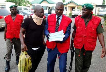 EFCC operatives leading fresh suspects in the N8 billion CBN staff fraud to the court premises in Ibadan, Oyo State