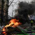 "Yellow vests = World revolution against finance!" There were clashes during the protests at Place de la Bastille in Paris