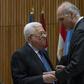 Palestinian president Mahmud Abbas (L) speaks with Syria's Ambassador to the United Nations Bashar Jaafari before meeting of the United Nations Group of 77 and China at the United Nations