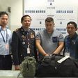 A Romanian, Narcis-Manuel Olaru (center), was arrested with 11 pounds of methamphetamine and led Cambodian Police to his three Nigerian accomplices and a fellow Romanian