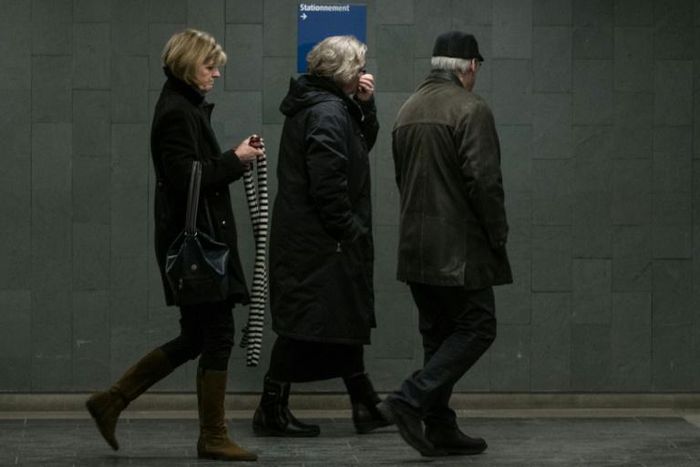 Alexandre Bissonnette's parents, Manon Marchand (L) and Raymond Bissonnette, exit Quebec City courthouse after hearing the sentence for their son on February 8, 2019