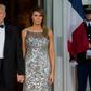 US President Donald Trump and First Lady Melania Trump, wearing Chanel couture, welcome French President Emmanuel Macron and his wife Brigitte Macron as they arrive for a State Dinner at the White House