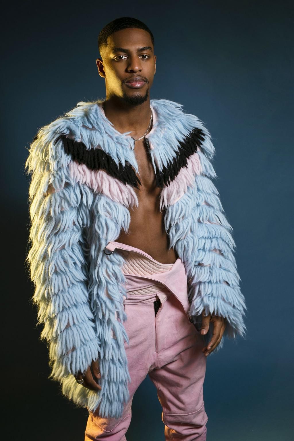 One of The Kupe Boys poses in an editorial for Glam Africa Magazine