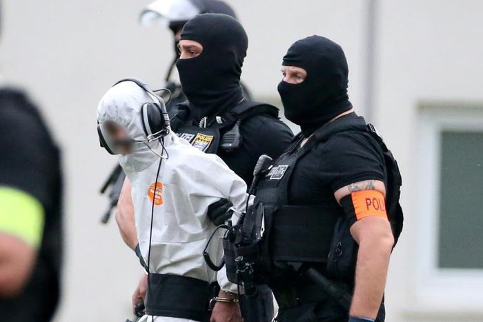 Police officers of a special unit escort Iraqi asylum-seeker Ali Bashar, pictured June 2018, who is accused of beating, raping and then strangling to death a German schoolgirl