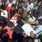 Tunisian mourners carry the coffin of a soldier who was killed by militants in a July 2014 attack