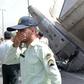 Iranian security forces stand at the scene of a previous plane crash near Tehran's Mehrabad airport on August 10, 2014