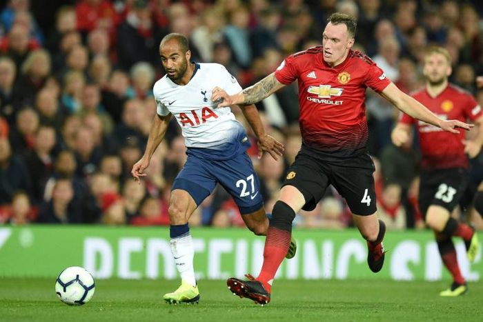 Manchester United defender Phil Jones (right) has extended his contract with the club until 2023