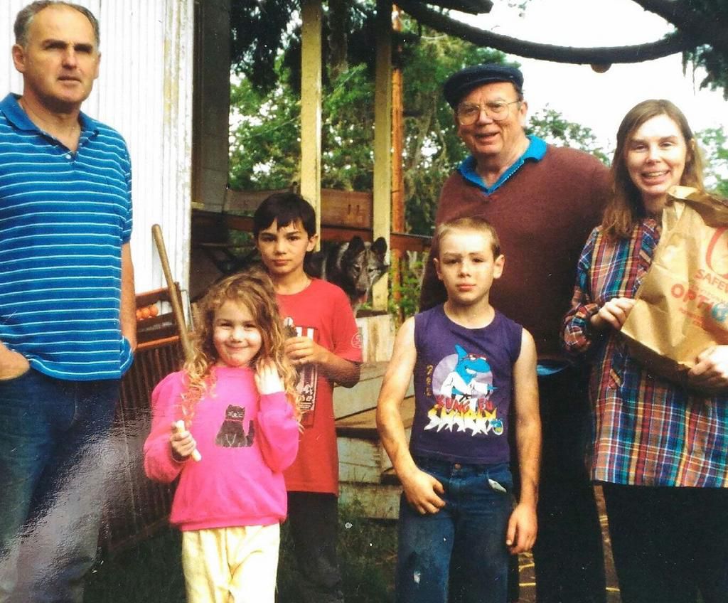 The author (in a purple tank) with his family around the time when he was poisoned.