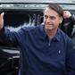 Brazil's right-wing President Jair Bolsonaro, pictured (right) with son Flavio Bolsonaro in October 2018, took office on January 1 after easily winning elections by promising a stern crackdown on corruption