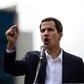 Venezuela's National Assembly head Juan Guaido speaks to the crowd during a mass opposition rally against leader Nicolas Maduro in which he declared himself the country's "acting president"