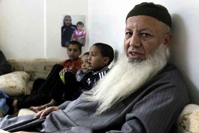 Salafist leader Abed Shehadeh, known as Abu Mohammad Tahawi, is seen with his grandsons in Jordan's Baqaa refugee camp for Palestinians on November 1, 2012