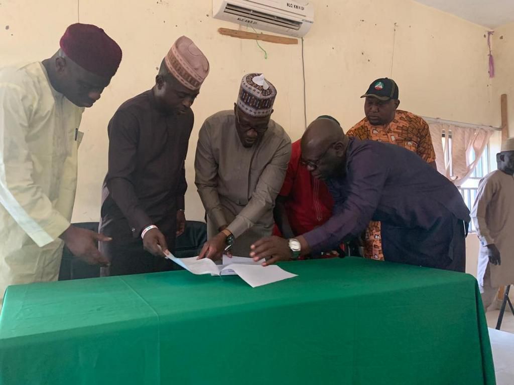 Representatives of state labour unions and government officials at the MoU signing.