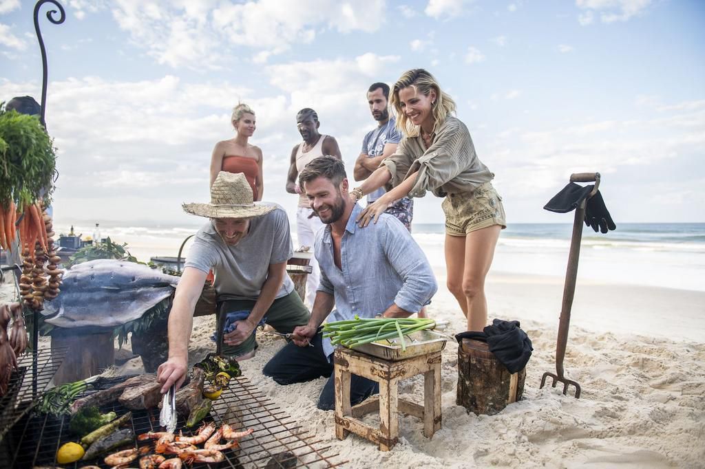 Hemsworth, Pataky, and members of the Centr team.