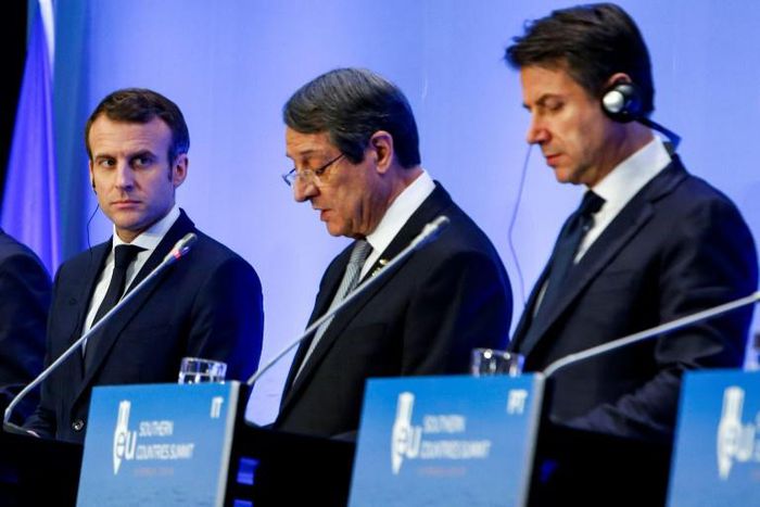 French President Emmanuel Macron (L) and Italian Prime Minister Giuseppe Conte listen as Cypriot President Nicos Anastasiades addresses a summit for southern EU countries in Nicosia on January 29, 2019