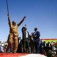 Sudan's President Omar al-Bashir defiantly brandishes his trademark cane as he addresses a loyalist rally in the capital Khartoum on January 9, 2019