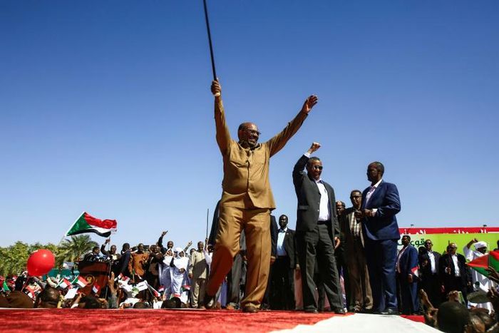 Sudan's President Omar al-Bashir defiantly brandishes his trademark cane as he addresses a loyalist rally in the capital Khartoum on January 9, 2019