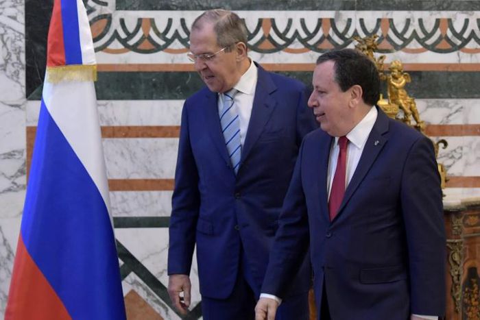 Tunisian Foreign Minister Khemaies Jhinaoui (R) receives visiting Russian Foreign Minister Sergei Lavrov in the capital Tunis on January 26, 2019