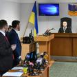 Lawyers (L) for ousted Ukrainian leader Viktor Yanukovych stand as a panel of three-judges begin to deliver the verdict of high treason against the former pro-Moscow president