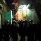Egyptian riot police block access to the street where the body of a suicide bomber lay covered in a sheet behind al-Azhar Mosque in Cairo