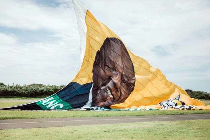 On the up: The ANC hoisted a giant New Year's banner bearing the face of Cyril Ramaphosa, credited with reviving party fortunes after the scandal-hit era of Jacob Zuma