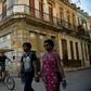 People walk past a building for sale in Havana, Cuba, as US Secretary of State Mike Pompeo warned foreign businesses to steer clear of formerly private properties seized by the island nation