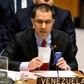 Venezuelan Foreign Minister Jorge Arreaza shows the Charter of the United Nations and the Constitution of Venezuela as he speaks to the United Nations Security Council