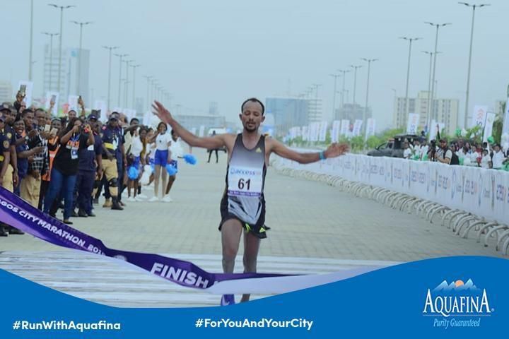 Sintayehu Legese breasting the tape at the finish of the 42km race