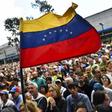 Anti-government activists listen to the president of Venezuela's opposition-led National Assembly Juan Guaido in Caracas on January 11, 2019